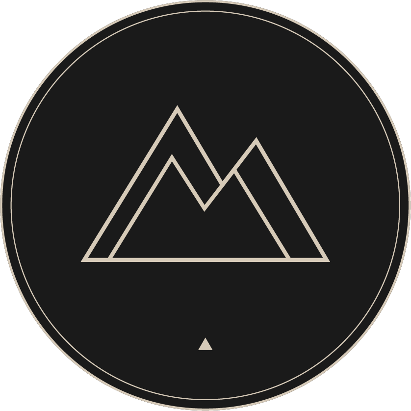 Tom McDermott mountain logo